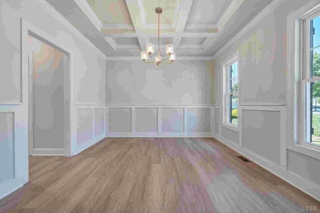 38 Shotman Rd, Rustburg, VA 24502 - unfurnished dining area featuring a chandelier, a decorative wall, wood finished floors, plenty of natural light, and coffered ceiling