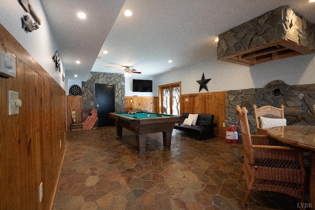 1582 Venturous Trl, Goode, VA 24556 - recreation room featuring a wainscoted wall, wood walls, billiards, ceiling fan, and stone floors