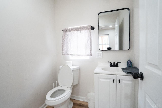 1582 Venturous Trl, Goode, VA 24556 - half bath with baseboards, toilet, vanity, and wood finished floors