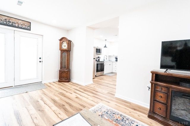1582 Venturous Trl, Goode, VA 24556 - foyer entrance with baseboards and light wood-style flooring