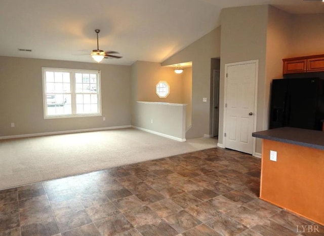 289 Todd Ln, Madison Heights, VA 24572 - unfurnished living room with a ceiling fan, baseboards, carpet floors, and vaulted ceiling