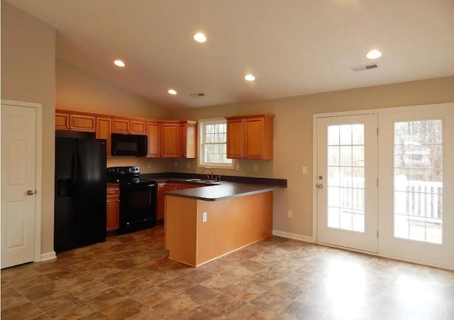 289 Todd Ln, Madison Heights, VA 24572 - kitchen with dark countertops, visible vents, a sink, black appliances, and a peninsula
