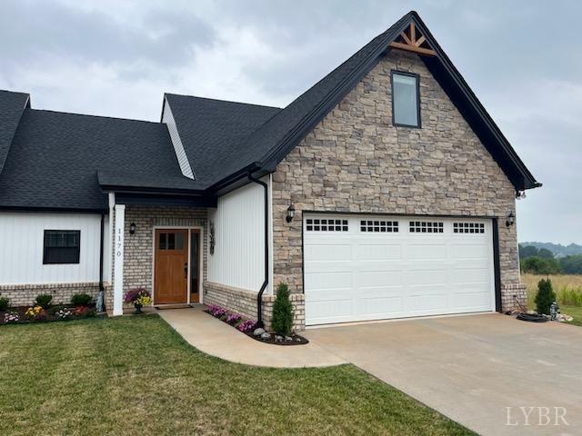 43 Grandset Dr, Forest, VA 24551 - view of front facade with concrete driveway, a front lawn, an attached garage, stone siding, and roof with shingles