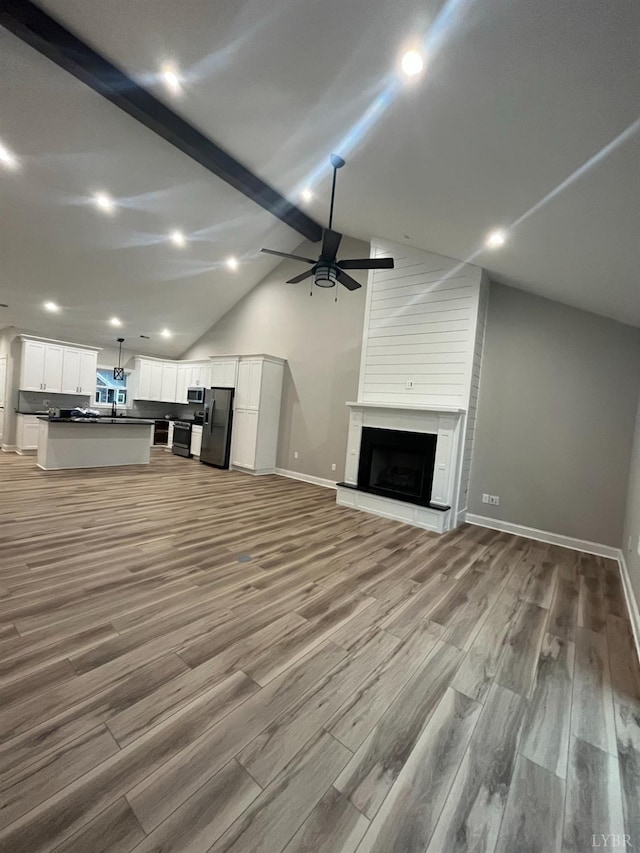 43 Grandset Dr, Forest, VA 24551 - unfurnished living room with ceiling fan, light wood-style floors, a fireplace, baseboards, and recessed lighting