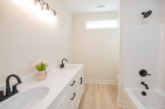 4 Live Oak Dr, Forest, VA 24551 - bathroom featuring wood finished floors, visible vents, toilet, and a sink