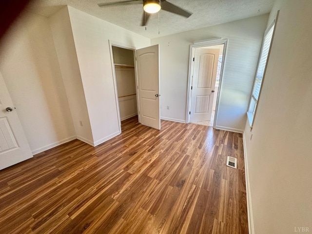 2809 Herbert St, Lynchburg, VA 24501 - unfurnished bedroom featuring wood finished floors, a closet, a ceiling fan, baseboards, and a textured ceiling