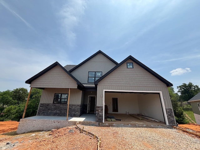 5 Live Oak Dr, Forest, VA 24551 - view of front of house with stone siding, a garage, and driveway