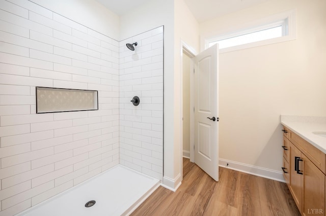 5 Live Oak Dr, Forest, VA 24551 - full bath featuring wood finished floors, vanity, baseboards, and tiled shower