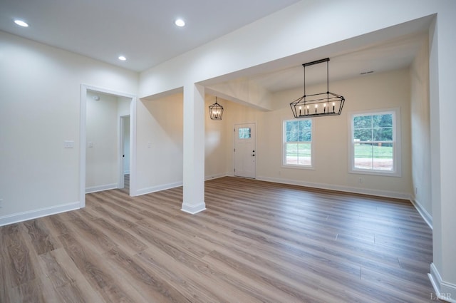 5 Live Oak Dr, Forest, VA 24551 - unfurnished living room with baseboards, recessed lighting, wood finished floors, and an inviting chandelier