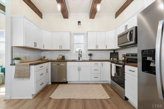 119 Ves Rd, Lynchburg, VA 24503 - kitchen with stainless steel appliances, a sink, beamed ceiling, light wood finished floors, and backsplash