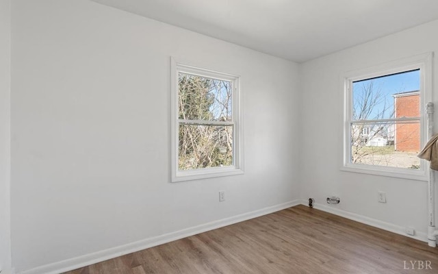 1209 15th St, Lynchburg, VA 24504 - empty room with baseboards, a wealth of natural light, and wood finished floors