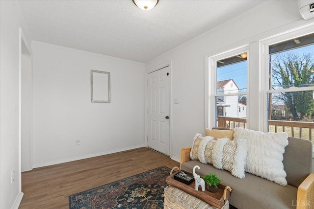 1209 15th St, Lynchburg, VA 24504 - living area featuring crown molding, a textured ceiling, baseboards, and wood finished floors