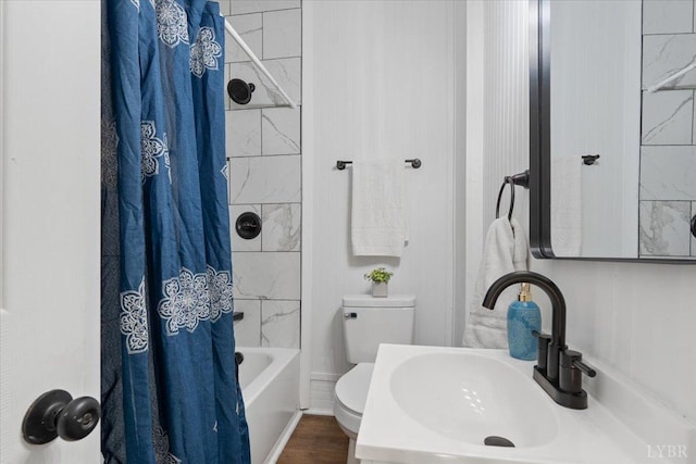 319 Kemper Rd, Danville, VA 24541 - bathroom featuring a sink, toilet, and shower / bath combo with shower curtain