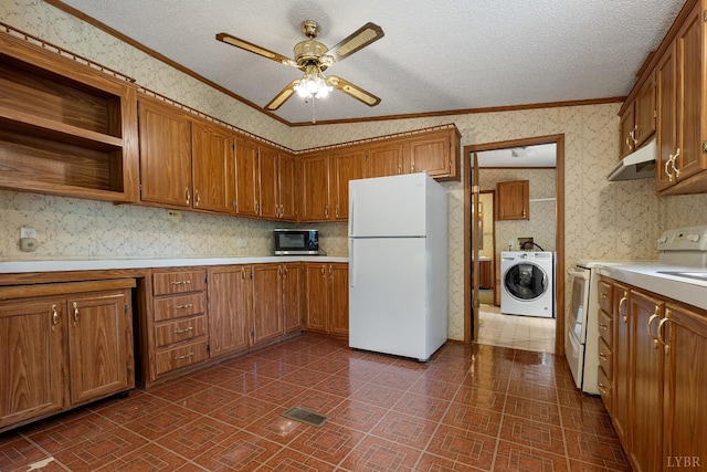 550 Mitchell Rd, Axton, VA 24054 - kitchen featuring white appliances, washer / dryer, wallpapered walls, light countertops, and ceiling fan