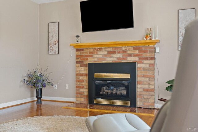 337 Virginia Ave, Appomattox, VA 24522 - detailed view of wood finished floors, a fireplace, and baseboards