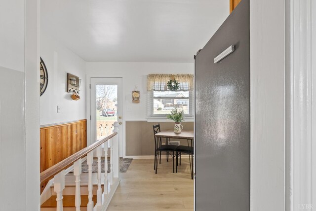 337 Virginia Ave, Appomattox, VA 24522 - hall with light wood-style flooring and a wainscoted wall