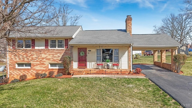 337 Virginia Ave, Appomattox, VA 24522 - view of front of home featuring brick siding, asphalt driveway, a chimney, covered porch, and a front yard