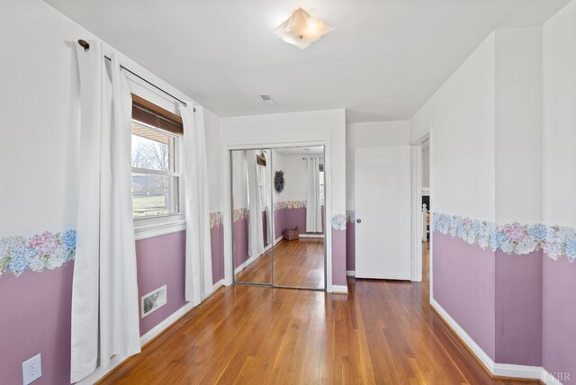 337 Virginia Ave, Appomattox, VA 24522 - unfurnished bedroom with wood finished floors and baseboards