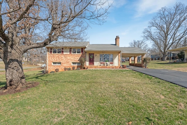 337 Virginia Ave, Appomattox, VA 24522 - split level home with a chimney, brick siding, driveway, covered porch, and an attached carport