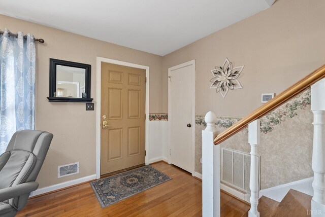 337 Virginia Ave, Appomattox, VA 24522 - foyer with wood finished floors, baseboards, and stairs