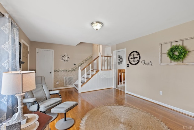 337 Virginia Ave, Appomattox, VA 24522 - living room with wood finished floors, stairway, and baseboards