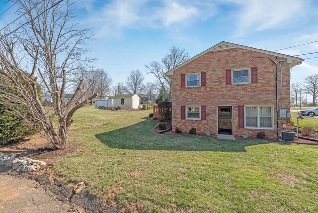337 Virginia Ave, Appomattox, VA 24522 - view of home's exterior featuring brick siding and a lawn