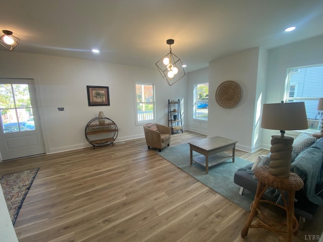 623 Monroe St, Lynchburg, VA 24504 - living area with wood finished floors, baseboards, recessed lighting, and a chandelier