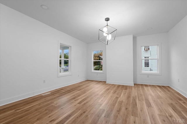 623 Monroe St, Lynchburg, VA 24504 - unfurnished dining area with light wood-style flooring and baseboards