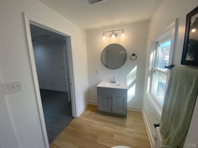 623 Monroe St, Lynchburg, VA 24504 - bathroom with wood finished floors, baseboards, and vanity