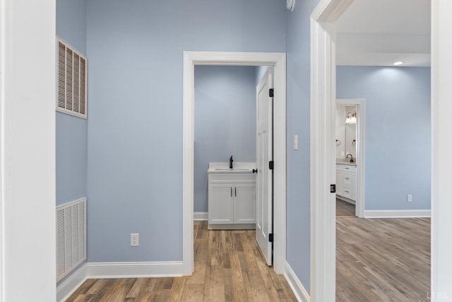 2135 Bellevue Rd, Forest, VA 24551 - corridor featuring wood finished floors and a heating unit