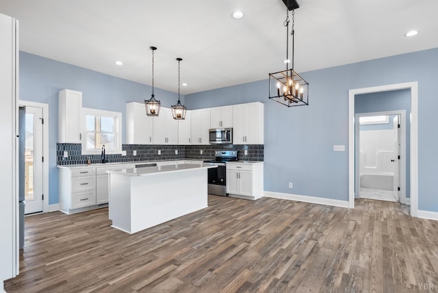 2135 Bellevue Rd, Forest, VA 24551 - kitchen featuring stainless steel appliances, dark wood-type flooring, decorative backsplash, white cabinets, and recessed lighting