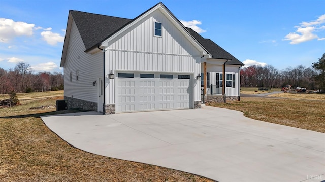 2135 Bellevue Rd, Forest, VA 24551 - view of front facade featuring driveway, board and batten siding, roof with shingles, and a garage