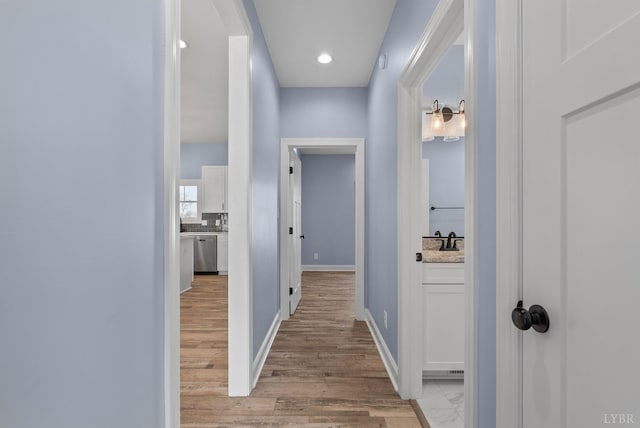 2135 Bellevue Rd, Forest, VA 24551 - hallway with light wood-type flooring, arched walkways, and recessed lighting