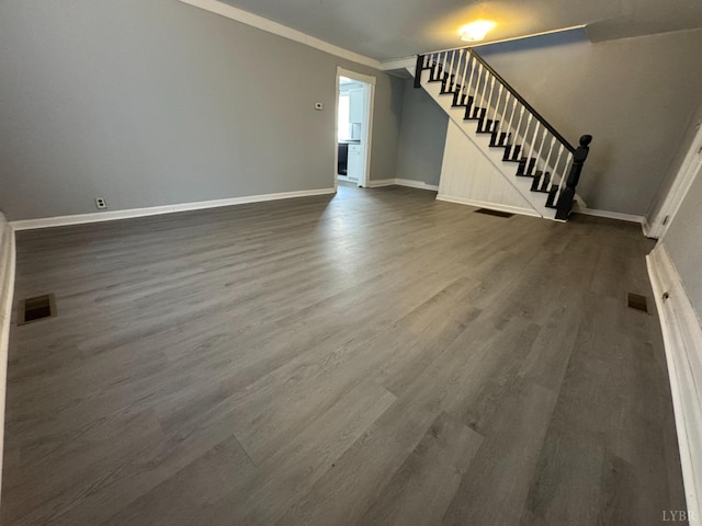 800 Spring St, Lynchburg, VA 24504 - unfurnished living room with stairway, dark wood-type flooring, baseboards, and ornamental molding