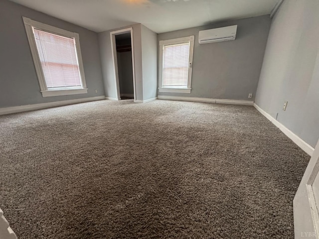 800 Spring St, Lynchburg, VA 24504 - unfurnished bedroom with a wall mounted AC, baseboards, carpet, and a closet