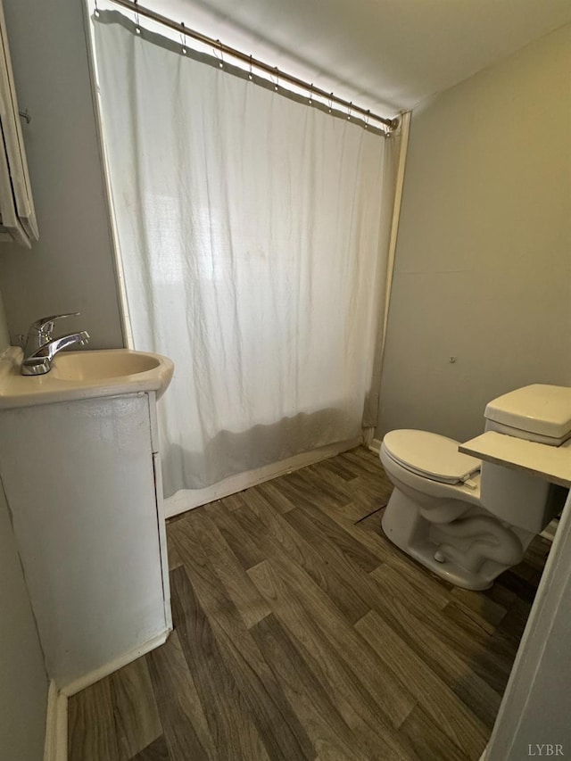 800 Spring St, Lynchburg, VA 24504 - full bath with wood finished floors, toilet, and vanity