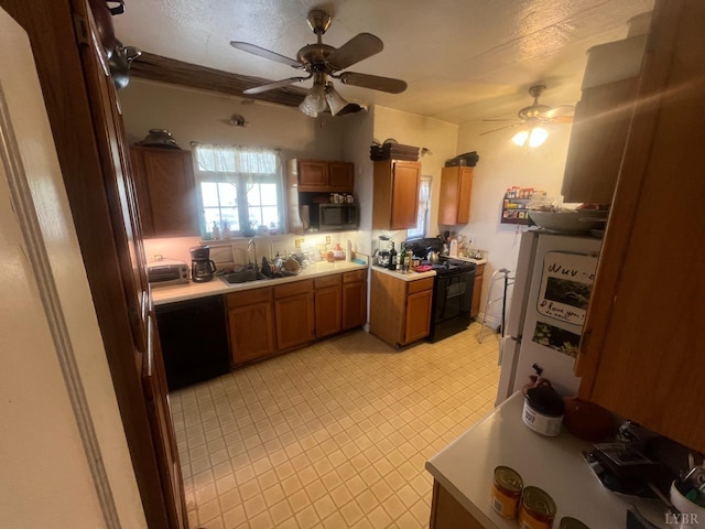807 Pershing Ave, Lynchburg, VA 24503 - kitchen featuring a ceiling fan, brown cabinetry, black appliances, and light countertops