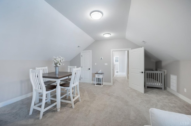 706 Elmwood Ave, Lynchburg, VA 24503 - dining room featuring vaulted ceiling, light carpet, and visible vents