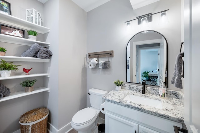 706 Elmwood Ave, Lynchburg, VA 24503 - bathroom with toilet, baseboards, and vanity