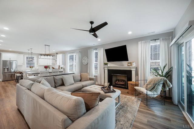 706 Elmwood Ave, Lynchburg, VA 24503 - living room featuring a fireplace, ceiling fan, wood finished floors, and recessed lighting
