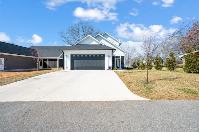 706 Elmwood Ave, Lynchburg, VA 24503 - modern farmhouse with a garage, driveway, a front yard, and board and batten siding