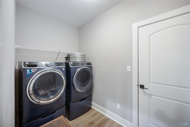 706 Elmwood Ave, Lynchburg, VA 24503 - clothes washing area featuring independent washer and dryer, light wood-type flooring, baseboards, and laundry area