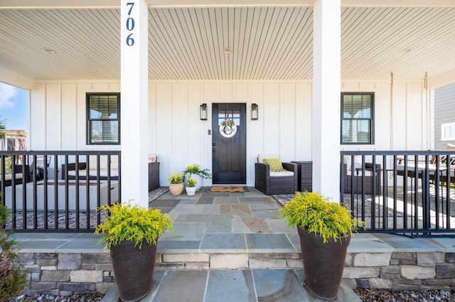 706 Elmwood Ave, Lynchburg, VA 24503 - view of exterior entry with covered porch and board and batten siding