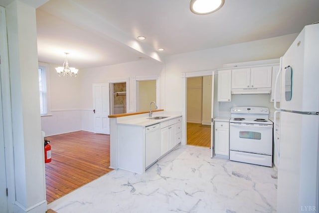 226 Denver Ave, Lynchburg, VA 24503 - kitchen featuring a peninsula, a sink, a notable chandelier, white appliances, and under cabinet range hood