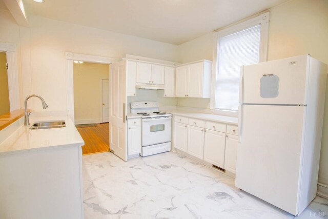 226 Denver Ave, Lynchburg, VA 24503 - kitchen with a sink, white cabinets, white appliances, under cabinet range hood, and light countertops