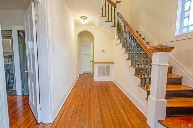 226 Denver Ave, Lynchburg, VA 24503 - interior space featuring arched walkways, stairway, wood-type flooring, and visible vents