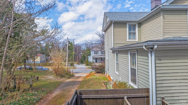 226 Denver Ave, Lynchburg, VA 24503 - view of side of home featuring roof with shingles and a chimney