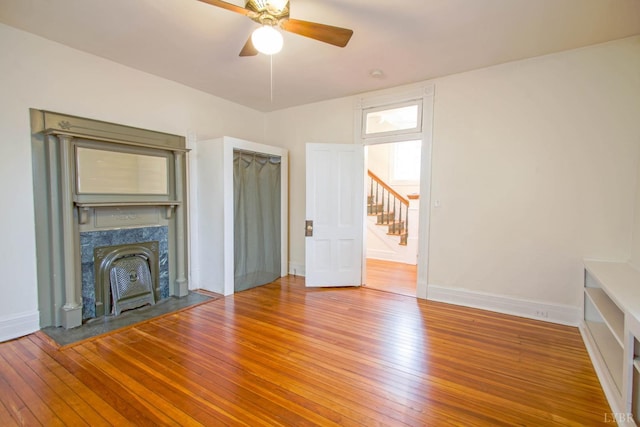 226 Denver Ave, Lynchburg, VA 24503 - unfurnished living room featuring hardwood / wood-style floors, baseboards, ceiling fan, and a high end fireplace