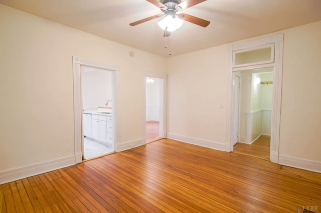 226 Denver Ave, Lynchburg, VA 24503 - spare room featuring a sink, ceiling fan, baseboards, and light wood-type flooring