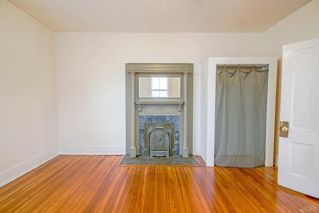 226 Denver Ave, Lynchburg, VA 24503 - unfurnished living room with wood-type flooring, baseboards, and a high end fireplace